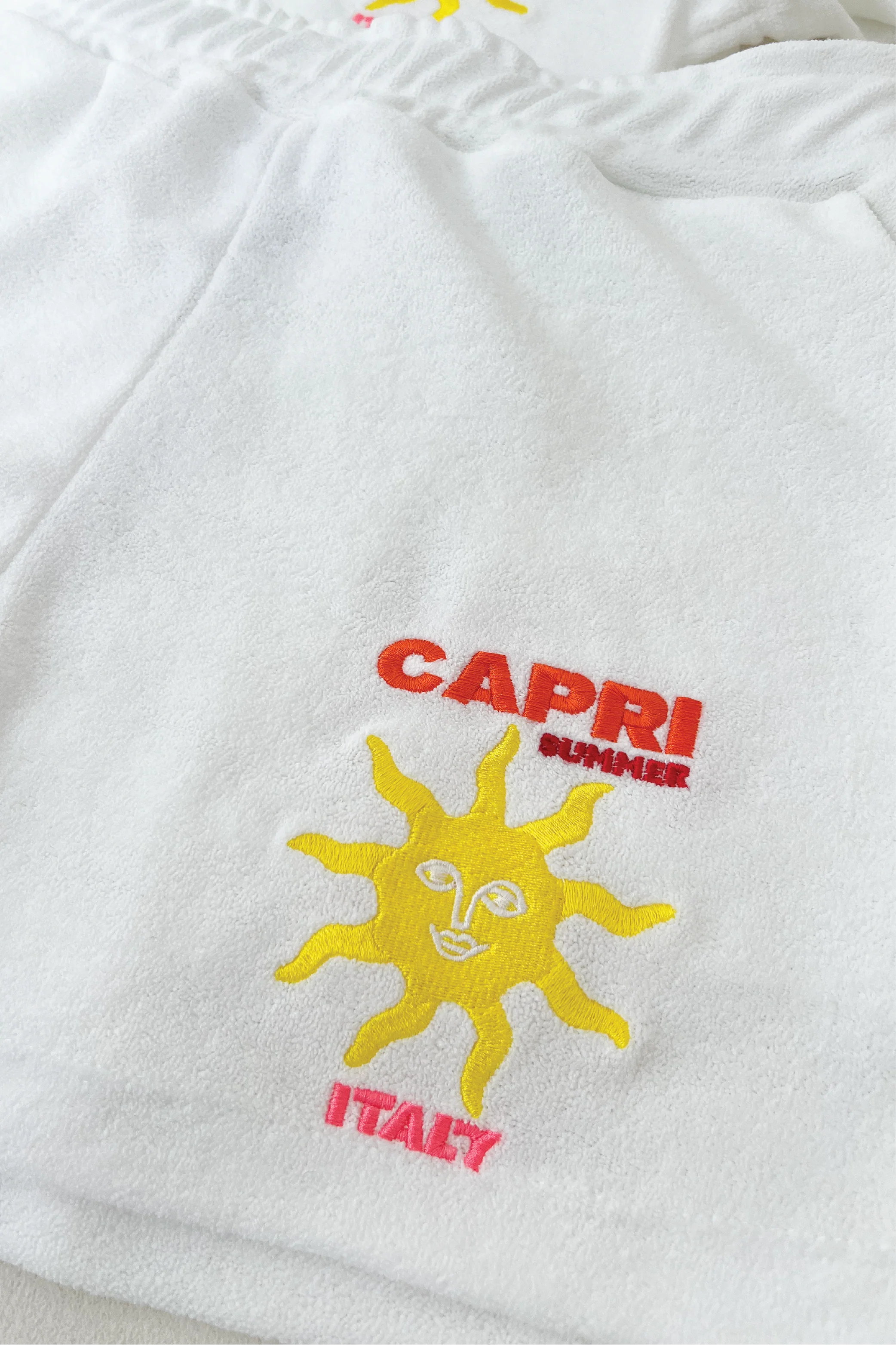 Capri white & orange embroidered towelling polo shorts co ord - Image 4